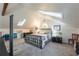 Charming bedroom with bright skylights, grey carpet, and a decorative stained glass window at 4442 Academy St, Acworth, GA 30101