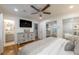 Spacious bedroom with wood floors, a ceiling fan, and access to an ensuite bathroom at 4442 Academy St, Acworth, GA 30101