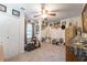 Functional room with ample storage, mirrored wall, and ceiling fan, blending practicality with unique décor at 4442 Academy St, Acworth, GA 30101