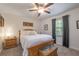 Cozy bedroom features a wooden bed frame, bedside table, and a ceiling fan for comfortable living at 4442 Academy St, Acworth, GA 30101