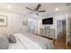 Bright bedroom with wood floors, ceiling fan, modern accents, and great natural light at 4442 Academy St, Acworth, GA 30101