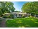 Beautiful home with a well-maintained lawn, lovely landscaping, and a charming front porch at 4442 Academy St, Acworth, GA 30101