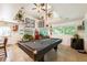Game room featuring a pool table, spiral staircase, and ample natural light at 4442 Academy St, Acworth, GA 30101