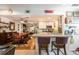 Open concept kitchen with granite countertops, white cabinets, and a view into the dining and living areas at 4442 Academy St, Acworth, GA 30101