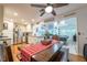 Open concept kitchen and dining area with granite countertops and a view into the game room at 4442 Academy St, Acworth, GA 30101