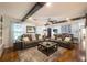 Spacious living room showcasing hardwood floors, comfortable seating, stylish decor, and a relaxing ambiance with natural light at 4442 Academy St, Acworth, GA 30101