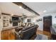 Bright and airy living room featuring hardwood floors, a fireplace, built-in shelving, and comfortable seating near entry door at 4442 Academy St, Acworth, GA 30101