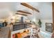 Upper-level loft space featuring wood beams and skylights overlooking the kitchen below at 4442 Academy St, Acworth, GA 30101