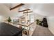 Upstairs landing featuring vaulted ceilings, a ceiling fan, and scenic backyard views at 4442 Academy St, Acworth, GA 30101