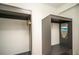 An empty gray, modern walk-in closet with hangers at 2411 Fair Lane Ln, Decatur, GA 30032