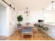 Bright dining room featuring a modern light fixture, table for six and a sliding barn door at 2411 Fair Lane Ln, Decatur, GA 30032