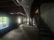 Unfinished basement with large windows and stair access at 481 Hammond Dr, Atlanta, GA 30328