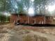Exterior brick home with large mature trees surrounding the property at 481 Hammond Dr, Atlanta, GA 30328