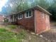 Charming brick home with white trim, lush greenery and a welcoming stairway at 481 Hammond Dr, Atlanta, GA 30328