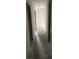 Long hallway with neutral color and view down to another room at 481 Hammond Dr, Atlanta, GA 30328