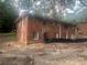 Back view of a two-story brick house, showcasing classic architecture and design at 481 Hammond Dr, Atlanta, GA 30328