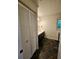Slate tile bathroom featuring a dark vanity at 713 Trickum Valley Dr, Woodstock, GA 30188