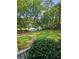 Picturesque front yard featuring verdant lawn and stepping stone path leading to the home at 713 Trickum Valley Dr, Woodstock, GA 30188