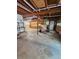 Garage featuring concrete flooring and built-in storage cabinetry along the wall at 713 Trickum Valley Dr, Woodstock, GA 30188