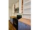 Updated kitchen featuring modern appliances, butcher block countertops, and stylish cabinetry at 713 Trickum Valley Dr, Woodstock, GA 30188