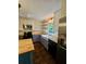 Modern kitchen equipped with stainless steel appliances, butcher block counters, and open shelving for storage at 713 Trickum Valley Dr, Woodstock, GA 30188