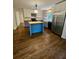 Spacious kitchen with center island, stainless steel refrigerator, and butcher block countertops at 713 Trickum Valley Dr, Woodstock, GA 30188