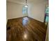 Spacious living room with hardwood flooring and ample natural light, perfect for entertaining at 713 Trickum Valley Dr, Woodstock, GA 30188