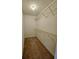 Walk-in closet offering ample storage space with metal shelving units at 713 Trickum Valley Dr, Woodstock, GA 30188