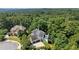 Aerial view of the house with surrounding forest and beautiful neighborhood at 135 Emerald Ln, Roswell, GA 30075