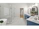 Elegant bathroom with double vanity, a glass-enclosed shower, and a soaking tub at 135 Emerald Ln, Roswell, GA 30075