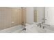 Bathroom featuring tiled walls, a bathtub, a vanity with sink, and a well-lit mirror at 135 Emerald Ln, Roswell, GA 30075