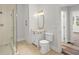 Bathroom featuring glass enclosed shower, stylish vanity and ceramic tile flooring at 135 Emerald Ln, Roswell, GA 30075