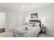 Comfortable bedroom with neutral decor, ceiling fan, and a view of the backyard at 135 Emerald Ln, Roswell, GA 30075