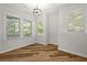 Well lit room with hardwood flooring and light gray walls at 135 Emerald Ln, Roswell, GA 30075