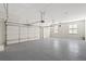 Spacious three car garage with high ceilings and ample room for storage and vehicles at 135 Emerald Ln, Roswell, GA 30075