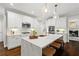 Spacious kitchen with white cabinets, a large island, stainless steel appliances, and a stylish design at 135 Emerald Ln, Roswell, GA 30075