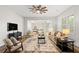 Open concept living room features hardwood floors, modern décor, and lots of light at 135 Emerald Ln, Roswell, GA 30075