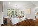 Bright and airy living room featuring a fireplace, hardwood floors, and large windows at 135 Emerald Ln, Roswell, GA 30075