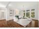 Bright living room with hardwood floors, built-in bookshelves, and large windows at 135 Emerald Ln, Roswell, GA 30075