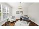 Stylish office space featuring hardwood floors, a modern desk, and a comfortable chair at 135 Emerald Ln, Roswell, GA 30075
