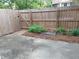 Cozy backyard with a privacy fence, a small garden, and a concrete patio at 1818 Ashborough Cir # E, Marietta, GA 30067