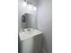 Bathroom with modern vanity, new sink and mirror and updated light fixture at 1818 Ashborough Cir # E, Marietta, GA 30067
