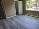 Neutral bedroom featuring wood-look floors and a window offering ample natural light at 1818 Ashborough Cir # E, Marietta, GA 30067