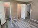 Bright bedroom features wood-look floors and access to closet at 1818 Ashborough Cir # E, Marietta, GA 30067