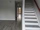The entryway features new flooring and a staircase with wooden railings at 1818 Ashborough Cir # E, Marietta, GA 30067