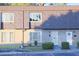 Charming townhome featuring a stylish shingle facade, neutral stucco, and well-maintained landscaping at 1818 Ashborough Cir # E, Marietta, GA 30067