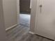 Hallway featuring wood-look floors and access to another room at 1818 Ashborough Cir # E, Marietta, GA 30067