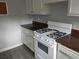 Kitchen offers white appliances, plenty of cabinet space and laminate countertops at 1818 Ashborough Cir # E, Marietta, GA 30067