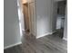 Living room with updated gray walls, with wood-look floors, and closet at 1818 Ashborough Cir # E, Marietta, GA 30067