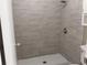 Modern shower featuring stylish tile, a rain showerhead, and sleek hardware at 1818 Ashborough Cir # E, Marietta, GA 30067
